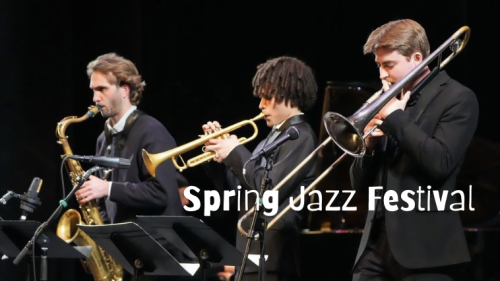 Three Jazz students on stage wearing black suits playing their horn instruments.