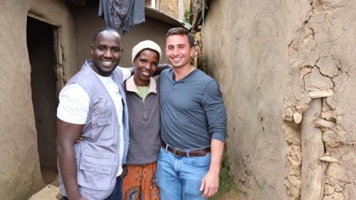 Dogon stands with two other people