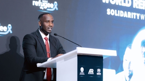 Dogon speaks from a podium