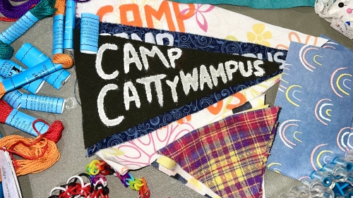 Summer camp supplies including banner for Camp Cattywampus