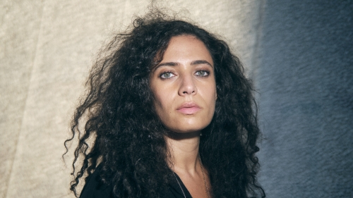 An image of author Hala Alyan fills the frame