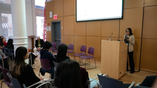 Sudha Arunachalam speaks from a podium.