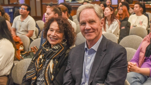 Jack Knott and Cherrie Short sit together in a crowd