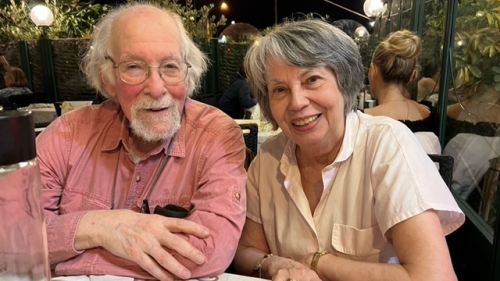 James and Anna sit at a table together
