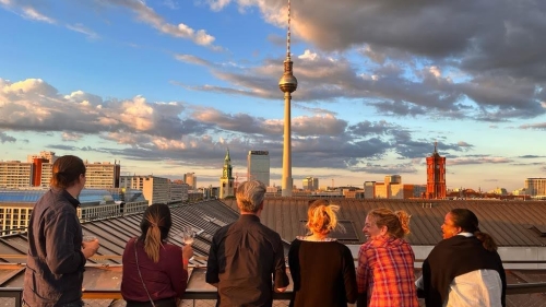 People look out over a skyline