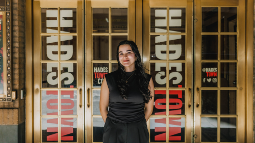 Silviana Abreu stands in front of doors