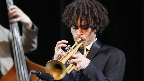 Jazz trumpet player close up on stage performing