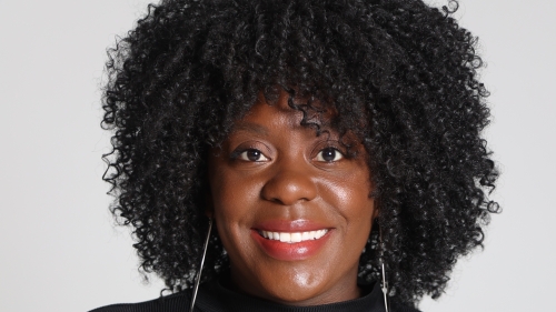 Dr. Chantal Hailey Headshot on grey backgorund. 