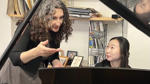 Professor working with piano studies student at the piano