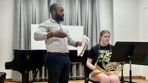 Professor working with Brass Studies Student in studio