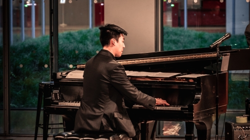 Lee plays piano