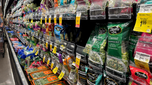 Grocery store shelves with Taylor Farms bagged greens