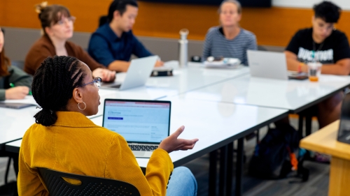 Students sitting around a seminar table.