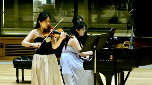Violinist and pianist performing together in Paulson Center