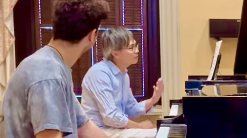 Professor working with piano student