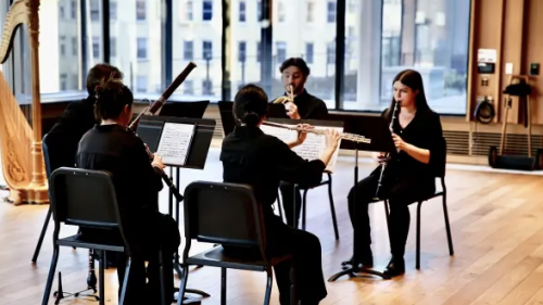 Five Woodwind players performing in paulson center room 620