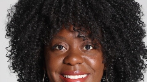 Headshot of Chantal Hailey smiling against a light gray background.