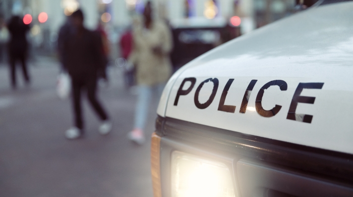 Closeup of the word police on a police car