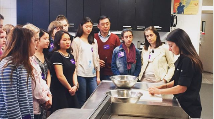 Students watching a demonstration in the Food Lab.