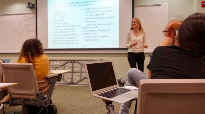 Jennifer Hill stands in front of her class.