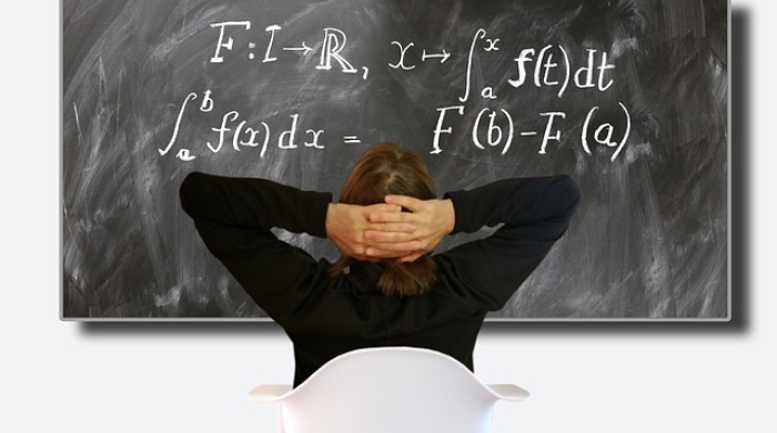 Woman looking at calculus equations