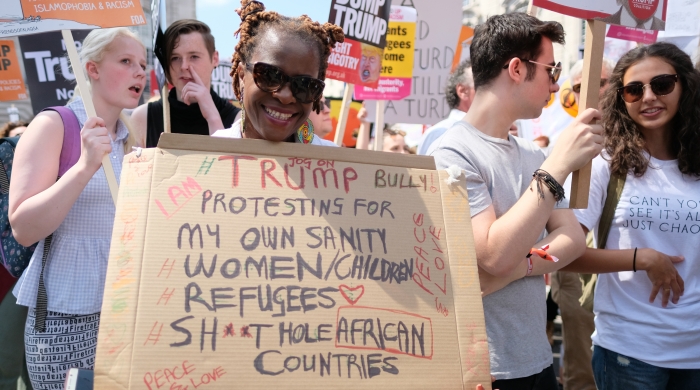 Woman holding a placard in a protest march