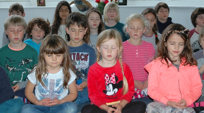 Primary school children meditating