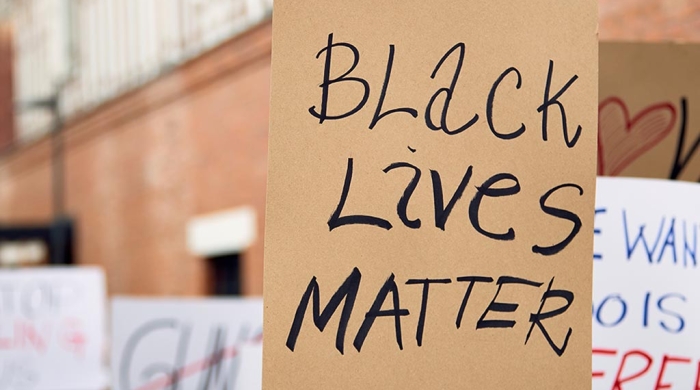 a protest march - the front sign says Black Lives Matter