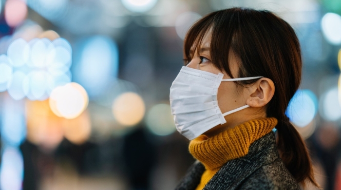 Asian woman side profile with mask