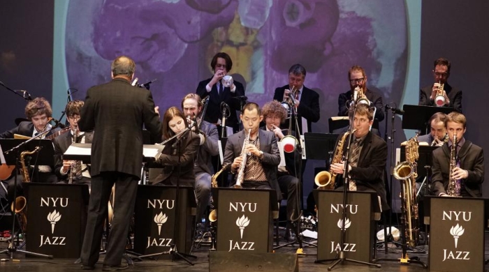 A picture of a group of NYU Jazz ensemble performing at a conservatory.