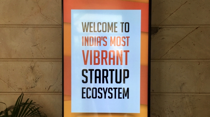 poster on wall that reads "welcome to India's most vibrant startup ecosystem"