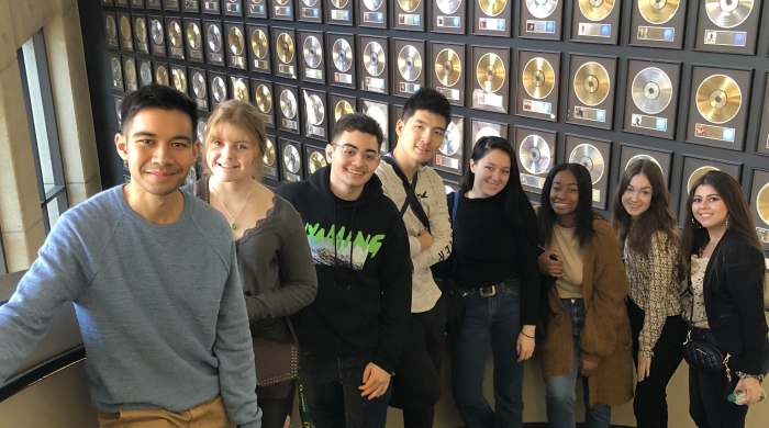 students pose in recording studio
