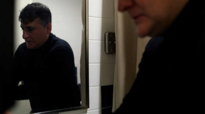 man and reflection in mirror 