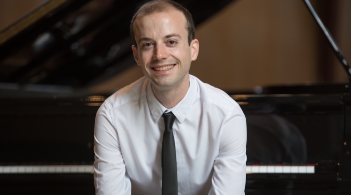 man with piano
