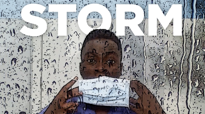 "Storm, A Tribute to Timothy Graphenreed" image of a man putting on a surgical mask seen through a window covered with raindrops