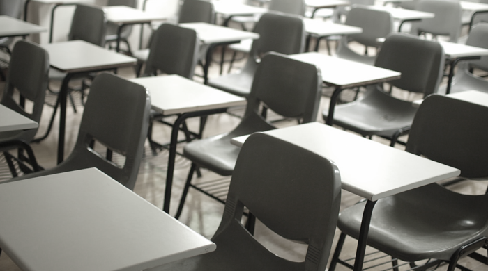 Empty desks and chairs in a classroom