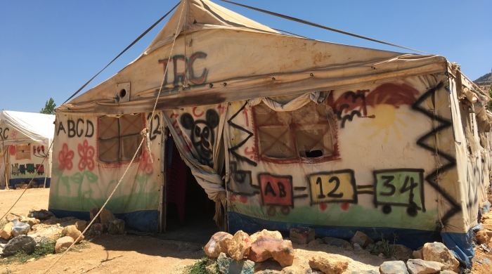 A tent school in a Lebanon. The tent is colorful.