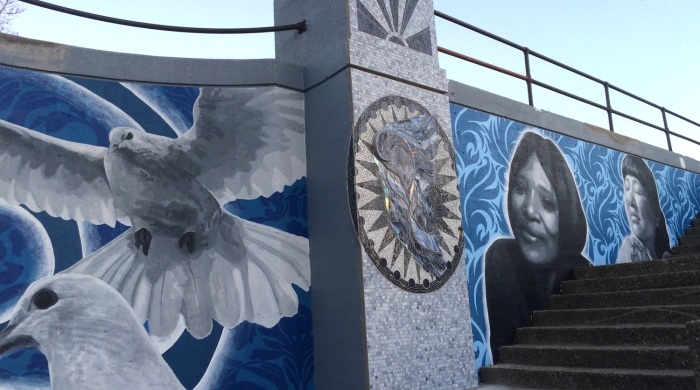Portion of Masten Park Mural with mosiac, white doves, and two women's faces