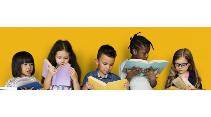 Five elementary school students read school textbooks in front of a yellow colored background