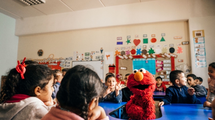 Elmo with children in a classroom in Saida, Lebanon