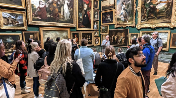 NYU Performing Arts Administration students at a museum in london in a room filled floor to ceiling with art