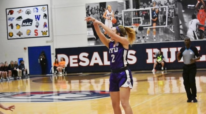 Honor Culpepper shoots a basketball during an NYU Violets game