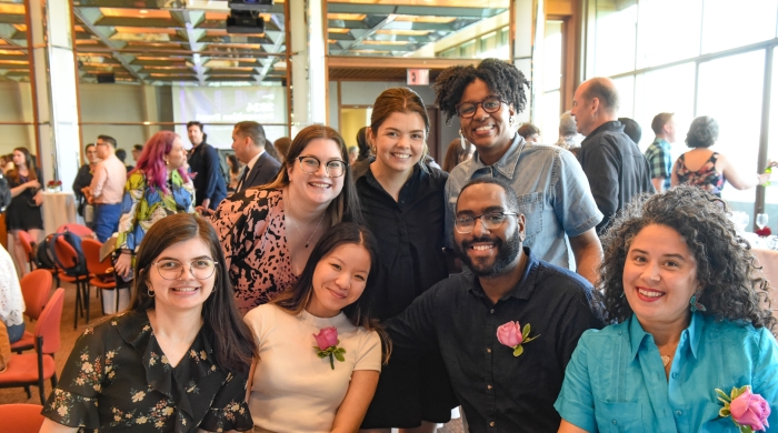 Members of the Teaching and Learning team and others pose at a dining table