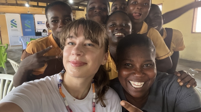 Selfie Photo of Emma Kate with Ghanaian school children
