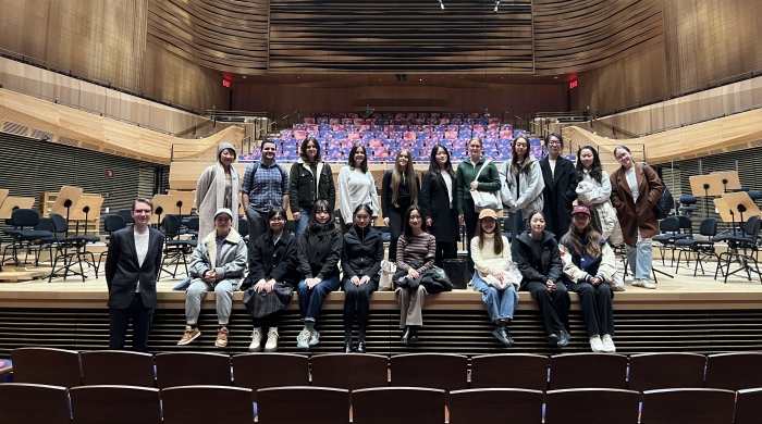 Group of PAA students sitting on stage in Lincoln Center
