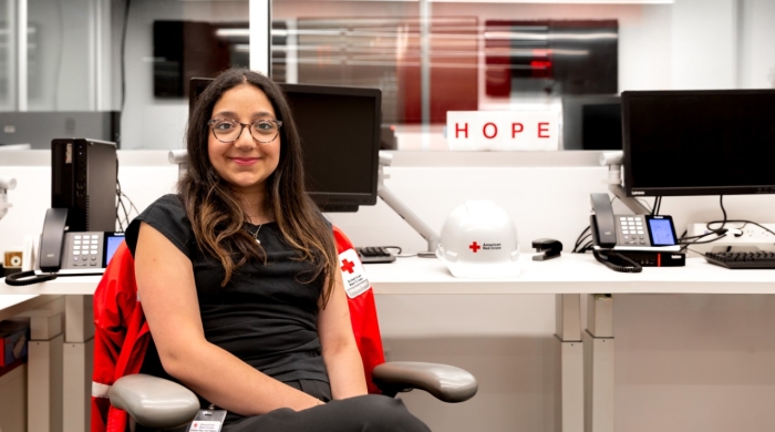 Isabela sits at her Red Cross desk