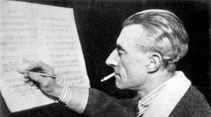 The pianist Ravel at the piano writing on the score