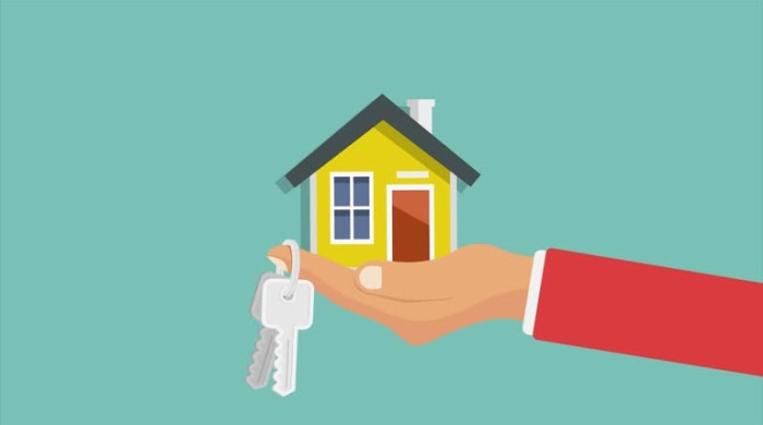 Imagine of a hand holding a tiny house in the palm and keys to home hanging from fingers