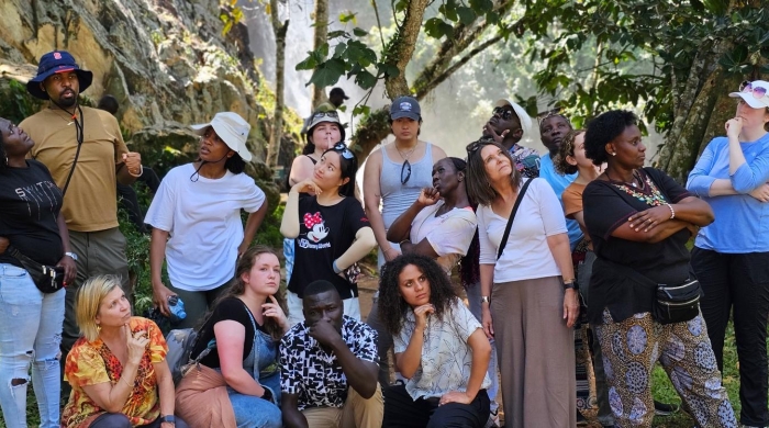 A group of students and faculty in Africa posing silly for the camera