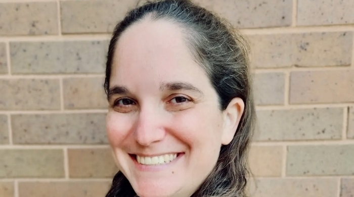 PAA alum Samantha Geffen headshot in front of light brick wall